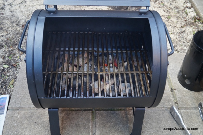 Since it's a new BBQ with an cast-iron grate, it needs some seasoning: pre-heating it in a coat of vegetable oil.