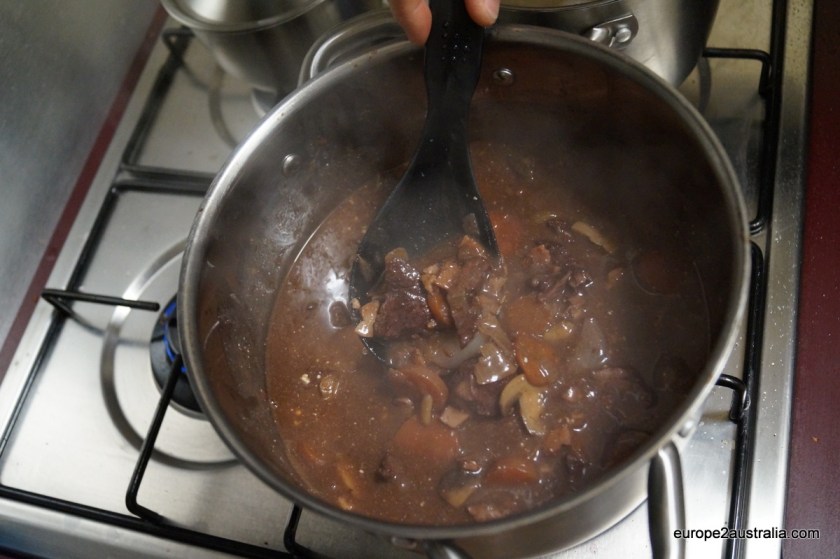 Add wine, stock and herbs and let simmer for three to four hours. Add the mushroom mix and let stew for another half an hour.