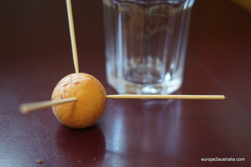 Step 3: Insert three toothpicks at an angle into the top of the pit.