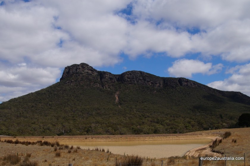 The hike first takes you along the bottom of the mountain, then turns and takes you up its " back" .