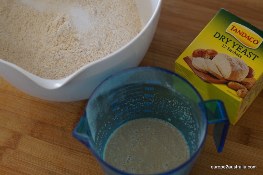 Add two satchels of dired yeast (7g per satchel) and a tablespoon of brown sugar to half a cup of lukewarm water.