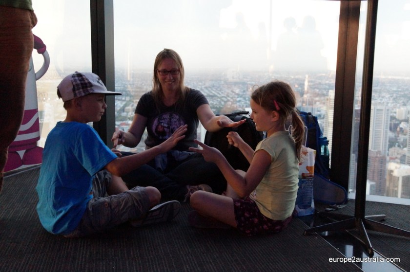 Waiting for sundown, we are playing rock, paper, scissors. With three people.