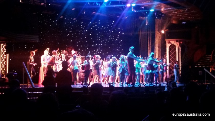 Singing and dancing on stage, with the help of some of the performers from the evening shows.