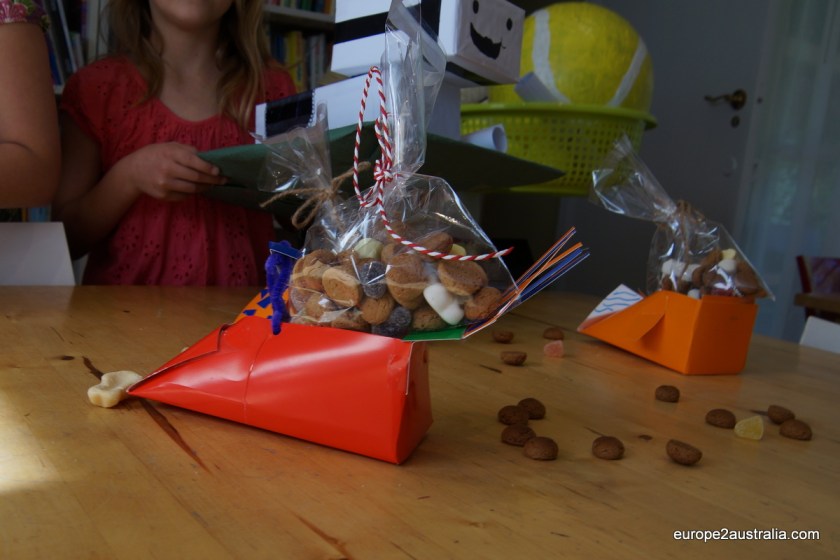 Pepernoten (little cookies) are liberally sprinkled around the room.